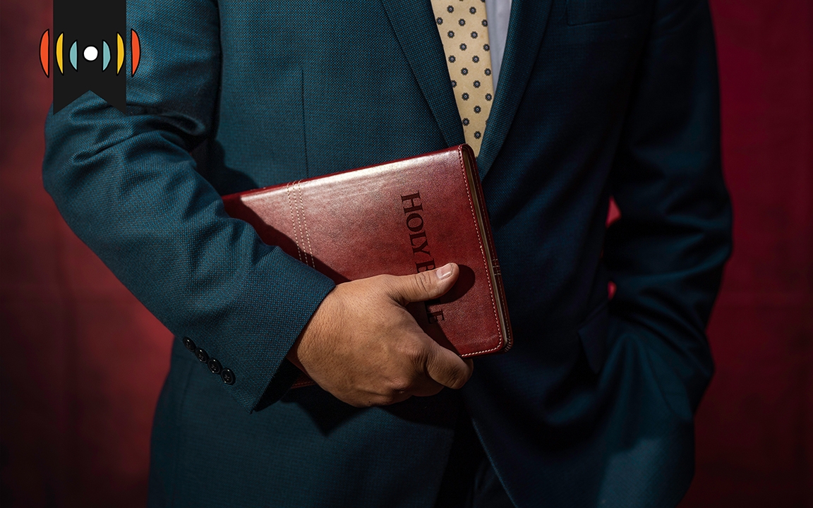 Man holding Bible TWE