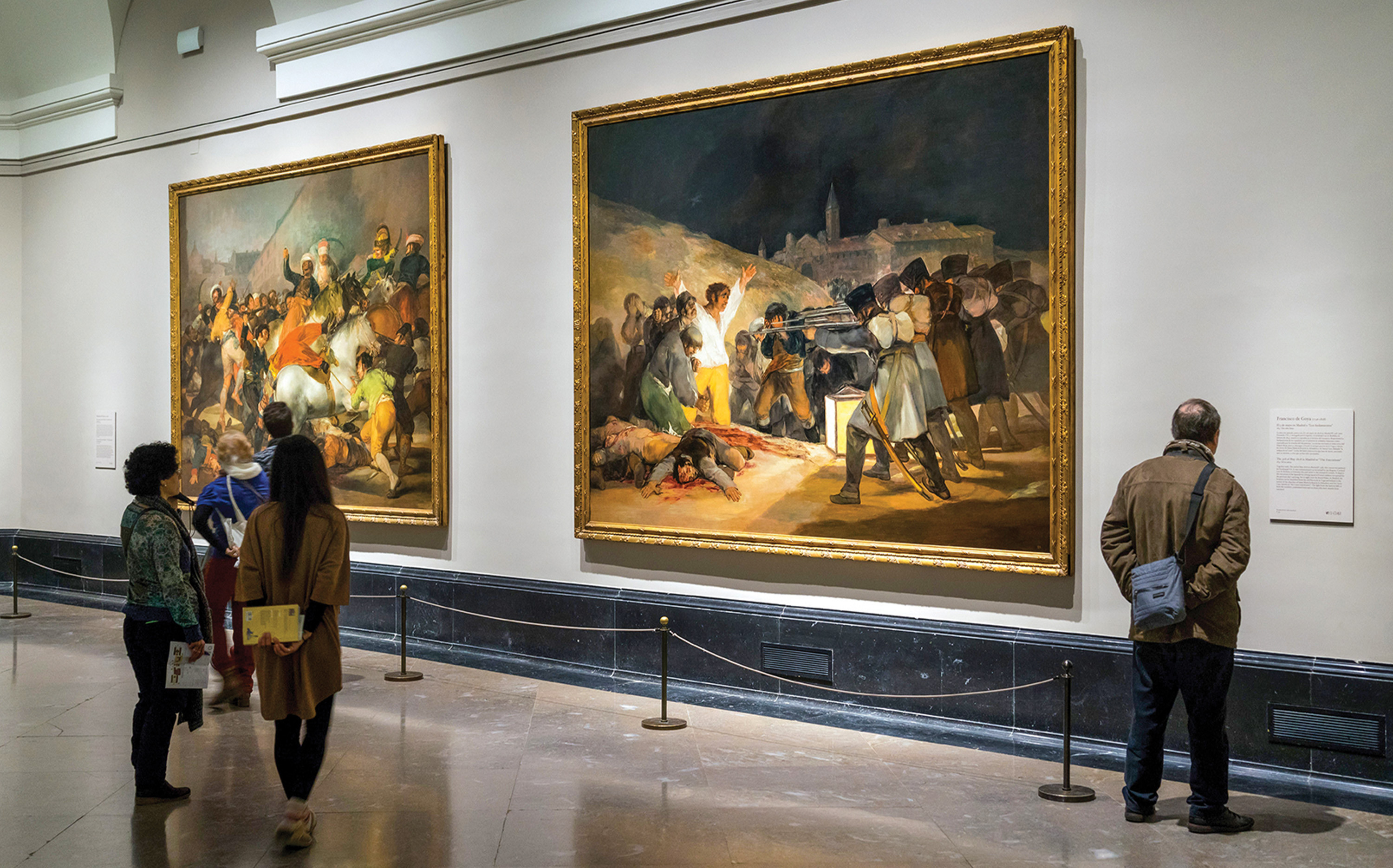 Visitors admire the painting at the Museo del Prado in Madrid.